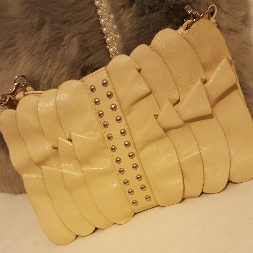 Cream colored little purse.